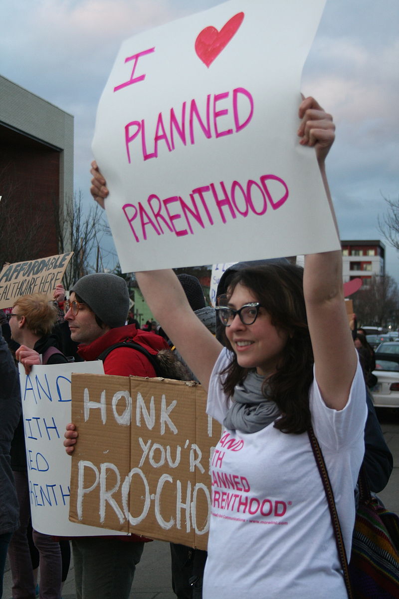 "Planned parenthood supporters" by S. MiRK - Flickr: planned parenthood supporters. Licensed under CC BY 2.0 via Commons